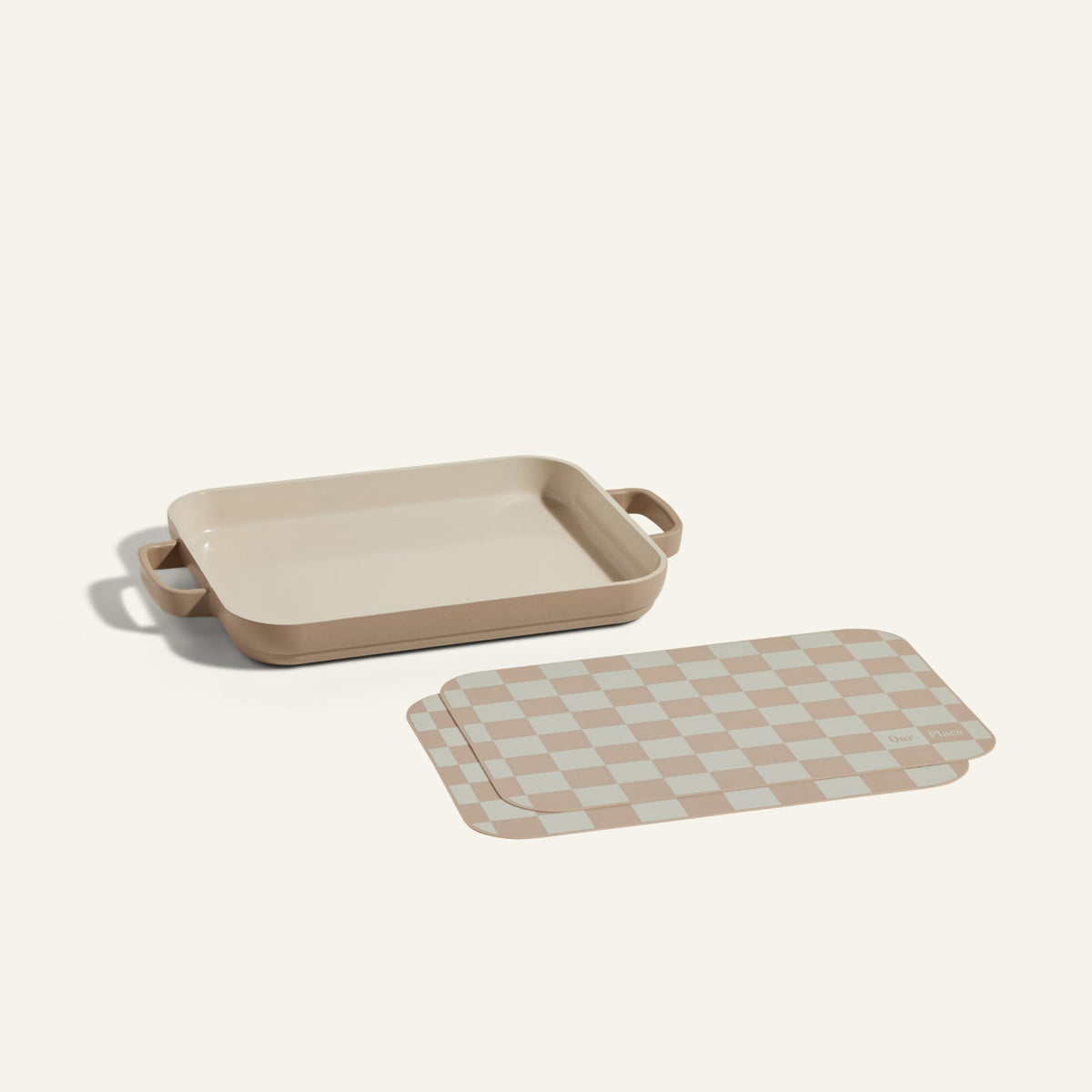 Mini Griddle Pan and Mini Oven Mats displayed on a plain light background, featuring a beige rectangular pan with handles next to matching checkered accessories.